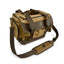 A brown waxed canvas blind bag with brass hardware, a waterproof rubber base, and a removable shoulder strap, featuring the DECOY canvasback logo.