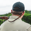 sport shooter wearing leather sunglasses strap