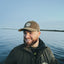 A man wearing a Salt Marsh Retro Corduroy Rope Hat shown from front angle, featuring classic rope detail and vintage outdoor aesthetic