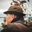 Duck hunter wearing Waxed Canvas Jones Hat in brown, shown from rear angle